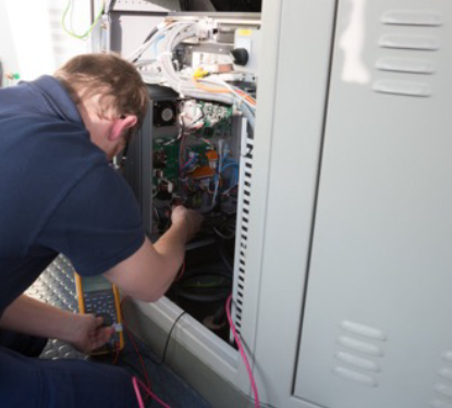 Radio Holland Technician working on a navigation console